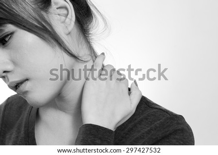 Young woman holding  neck in pain and discomfort