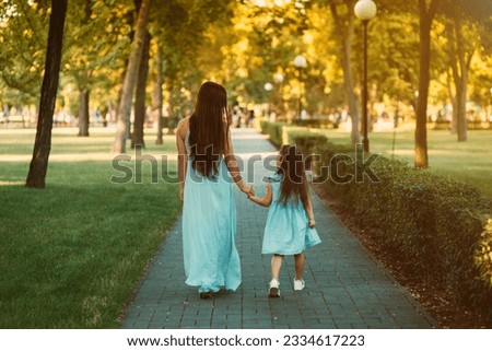 Similar – Image, Stock Photo Young mom walking with her baby during covid pandemic