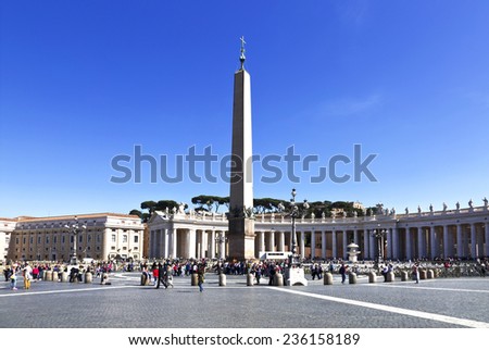 VATICAN CITY, VATICAN - MAY 5 2014: Tourists at Saint Peter\'s Square in Vatican City, Vatican. Saint Peter\'s Square is among most popular pilgrimage sites for Roman Catholics.