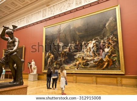 ST. PETERSBURG, RUSSIA - JULY 11, 2015. Russian Museum, the youth near painting Bruni \