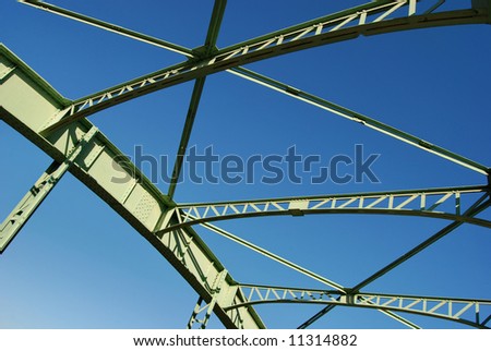 Detail of steel bridge construction over sky