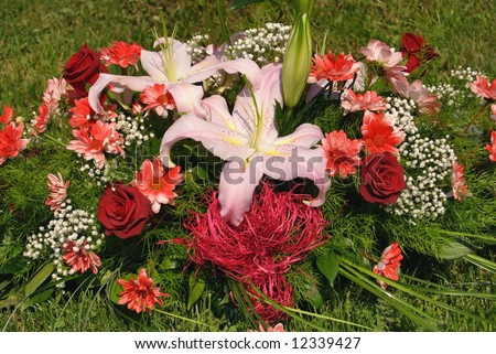 Flowers for wedding decoration on green grass