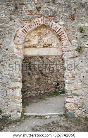 PLATAMON, PLATAMONAS, GREECE- AUGUST 01: Stone door in old 12th century Byzantine castle in Platamonas - Platamon  August 01. 2014. Olympus region, Macedonia, Greece