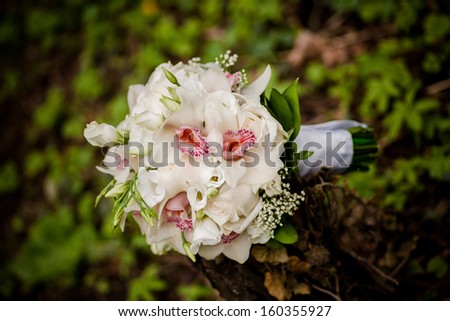 Bridal bouquet in white flowers laying down