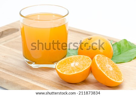 orange sliced and orange juice on chopping board background