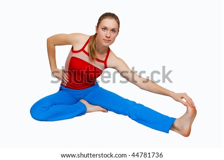Young fitness woman doing stretching for the back of her calf muscle as part of warming down routine