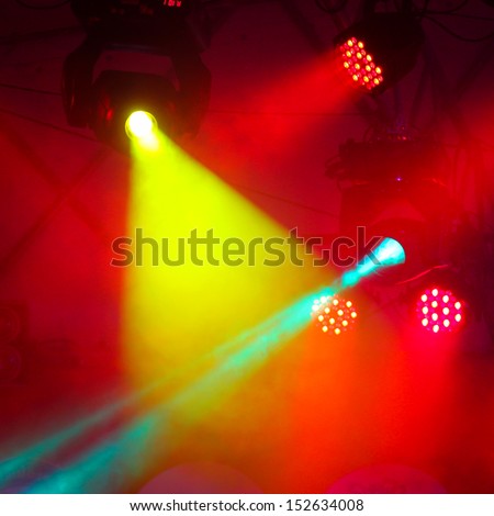 concert stage with colors spot light and smoke