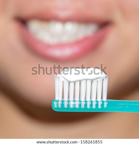 Beautiful woman with toothbrush. Dental care background