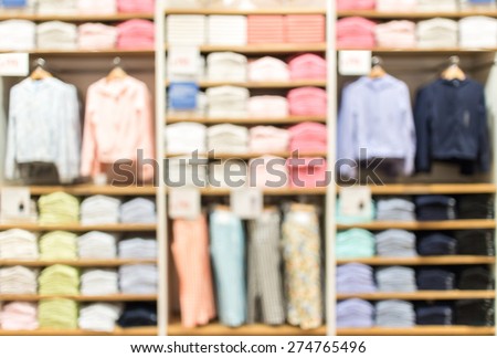 blurred abstract  background of multicolored cotton clothing on the shelves of fashion shop.