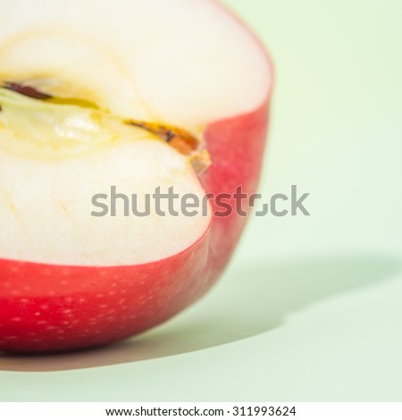 sliced apple fruit isolated on green background, pop art color concept