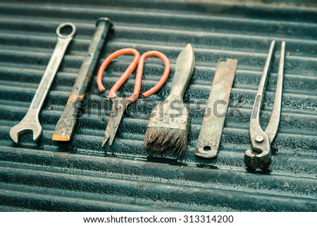 mechanic tools set on dirty zinc background