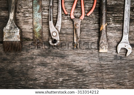 mechanic tools set on dirty wooden background