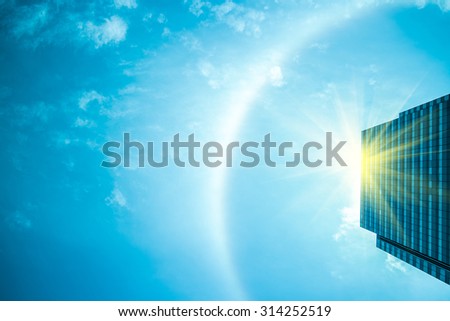 fantastic beautiful sun halo phenomenon above the modern building