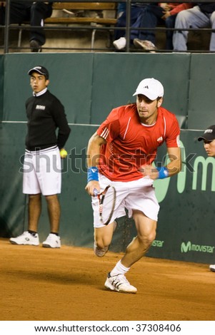 RANCAGUA, CHILE - SEPTEMBER 18: Nicolas Massu of Chile runs in the court in the match against Jurgen Melzer of Austria during the Davis Cup on September 18, 2009 in Chile.