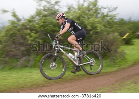 SANTIAGO, CHILE - SEPTEMBER 27: Rider number 16 goes downhill on Alpes Cup, mountain bike competition on September 27, 2009 in Santiago, Chile.