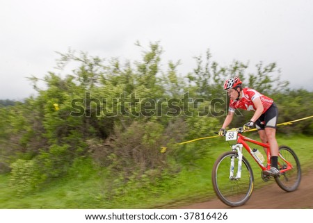 SANTIAGO, CHILE - SEPTEMBER 27: Rider number 58 goes downhill on Alpes Cup, mountain bike competition on September 27, 2009 in Santiago, Chile.