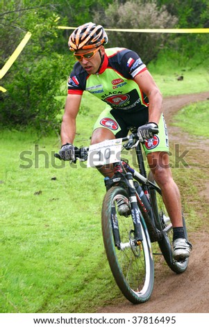 SANTIAGO, CHILE - SEPTEMBER 27: Rider number 10 goes downhill on Alpes Cup, mountain bike competition on September 27, 2009 in Santiago, Chile.