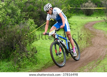 SANTIAGO, CHILE - SEPTEMBER 27: Rider number 59 goes downhill on Alpes Cup, mountain bike competition on September 27, 2009 in Santiago, Chile.