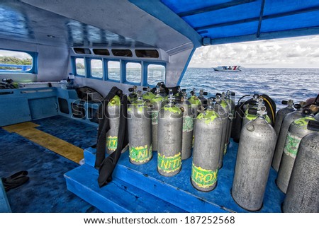 Tank on scuba diving boat in Tropical crystal water