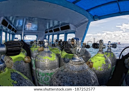 Tank on scuba diving boat in Tropical crystal water