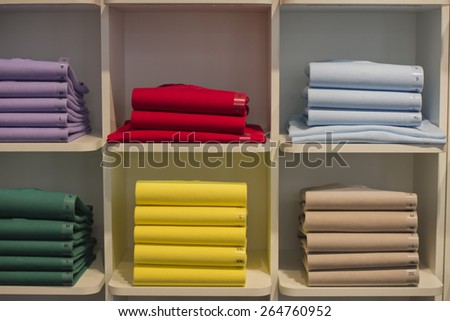 different colors polo shirt on display stand