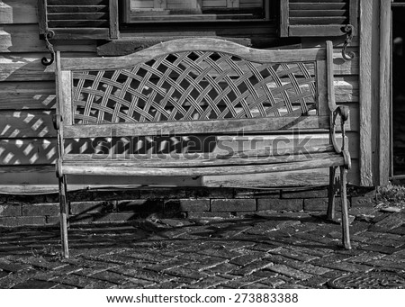 isolated wood and iron bench on wood old far west style house background