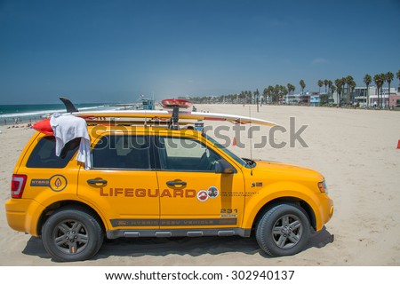 LOS ANGELES, USA - AUGUST 5, 2014 - lifeguard yellow car in venice beach landscape in los angeles