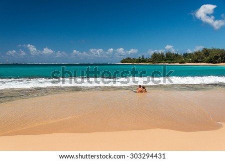 HONOLULU, USA - AUGUST, 14 2014 -  People having fun at hawaii island beach