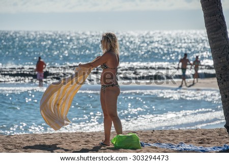 HONOLULU, USA - AUGUST, 14 2014 -  People having fun at hawaii island beach