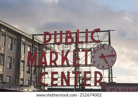 SEATTLE, USA - OCTOBER 26, 2014: Public Market Center sign in Seattle downtown on October 26, 2014. Pike street market is famous for fresh produce, delicious food and unique arts and crafts.