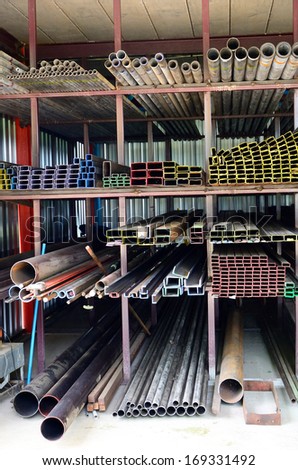 Stack of iron pipes in an iron shop.
