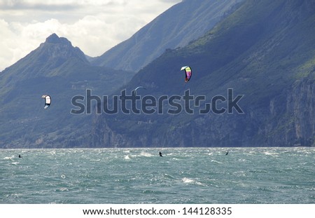 Water sports, kite-boarding on the lake garda north Italy.