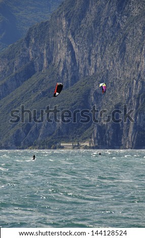 Water sports, kite-boarding on the lake garda north Italy.