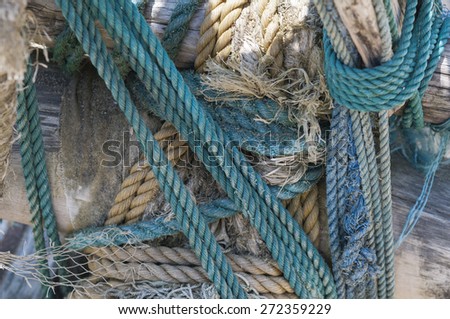 Background of old rope with knots in a ship.