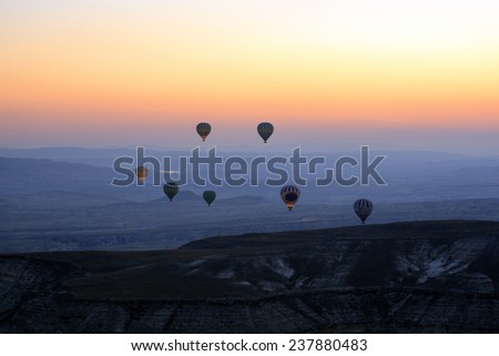 CAPPADOCIA, TURKEY, AUGUST, 12 : Early morning in Cappadocia, Turkey, dozens of hot air balloons offer guests from all over the spectacular and  views of the Cappadocian  landscape on August 12, 2014
