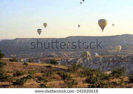 CAPPADOCIA TURKEY, AUGUST, 12: Early morning in Cappadocia, Turkey, dozens of hot air balloons offer guests spectacular views of the Cappadocian lunar like landscape on August 12, 2014
