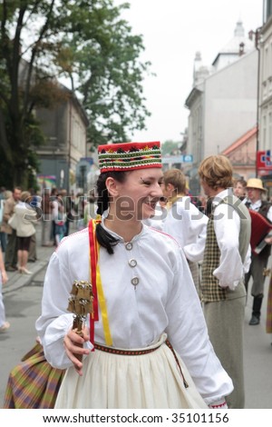 ZYWIEC, POLAND - AUGUST 6 2009: Participants of the 46th Beskidy Highlanders Week of Culture (TKB), the biggest folk culture event in Eastern Europe, parade through the folk group from Austria