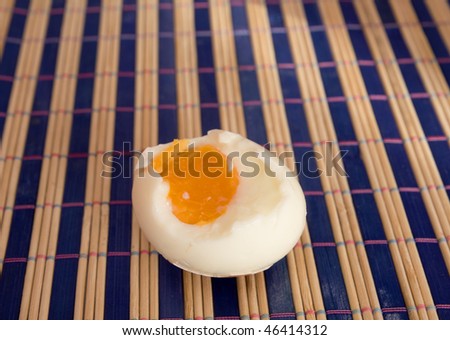 bitten egg on color mat