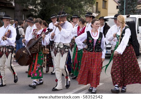 SZCZYRK, POLAND–AUGUST 1: Participants of the 47th Beskidy Highlanders Week of Culture (TKB), the biggest folk culture event in Eastern Europe, parade through the city, folk group from Poland on August 1, 2010 in Szczyrk, Poland