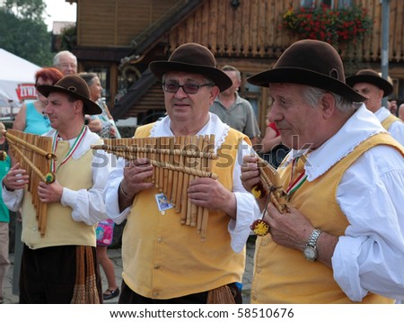 ZYWIEC, POLAND - AUG 5: Participants of the 47th Beskidy Highlanders Week of Culture (TKB), the biggest folk culture event in Eastern Europe, parade through the city, folk group from Italy on August 5, 2010 in Zywiec, Poland
