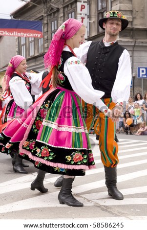 ZYWIEC, POLAND - AUGUST 5: Participants of the 47th Beskidy Highlanders Week of Culture (TKB), the biggest folk culture event in Eastern Europe, parade through the city, folk group from Poland on August 5, 2010 in Zywiec, Poland