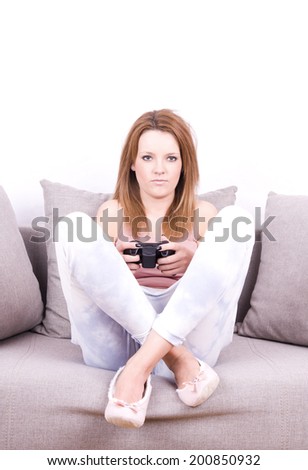 young girl relaxing and playing video games