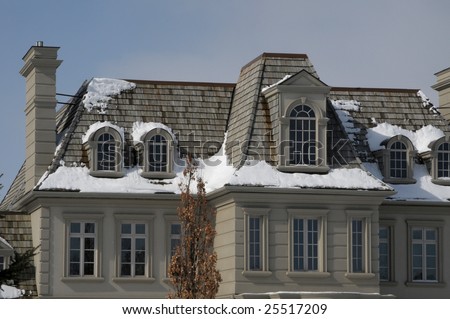 Large mansion with cedar shake roof