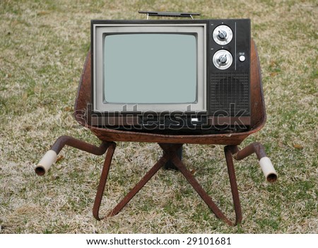 Old TV in a wheelbarrrow