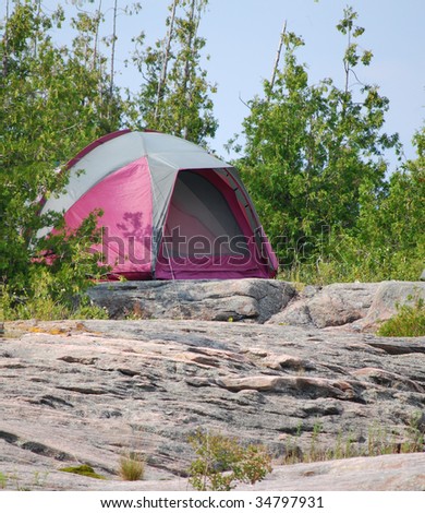 Purple tent on rocks