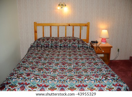 Single bed with a wooden headboard