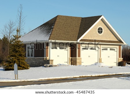 Triple garage in winter setting