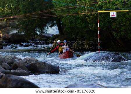 MINDEN, ONTARIO - SEPT 10: Two unidentified contestants compete at Open Canoe Slalom Race, 2011 at Gull River in Minden, Ontario, Canada.