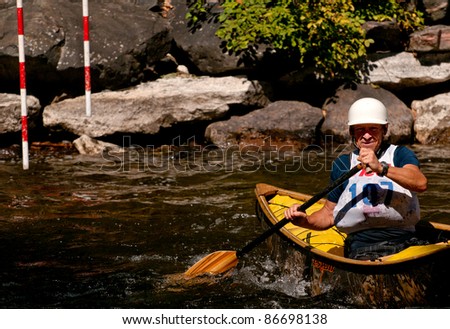 MINDEN, ONTARIO, CANADA - SEPT. 10: An unidentified contestant competes at Open Canoe Slalom Race, 2011 at Gull River in Minden, Ontario, Canada on September 10, 2011.