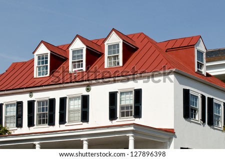 House with red roof and dormer windows